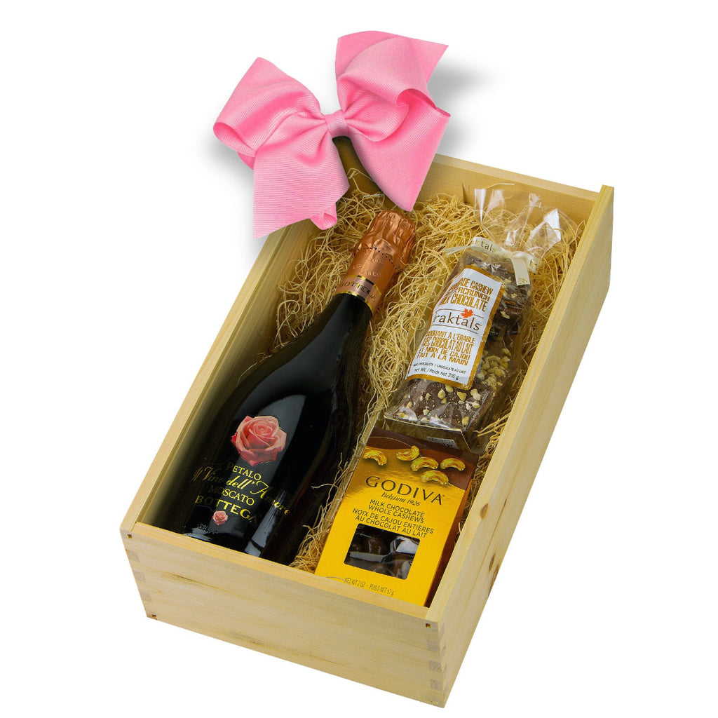 wooden gift box containes sparkling wine, champaign and chocolates, the best gift for her