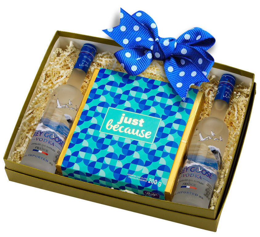 golden gift box with just because purdys chocolate box and two bottle of grey goose french vodka