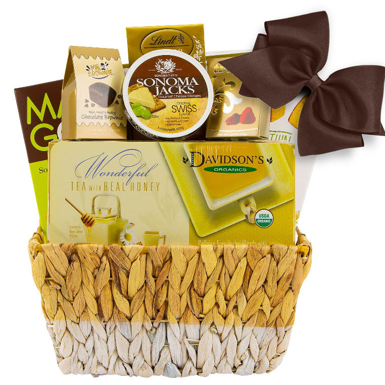 gift basket with organic tea box organic cookies and crackers, cheese and chocolate