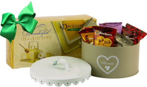 organic Davidson tea box and Round "Biscuits" tin with scalloped edge cover full of walkers individually packed cookies